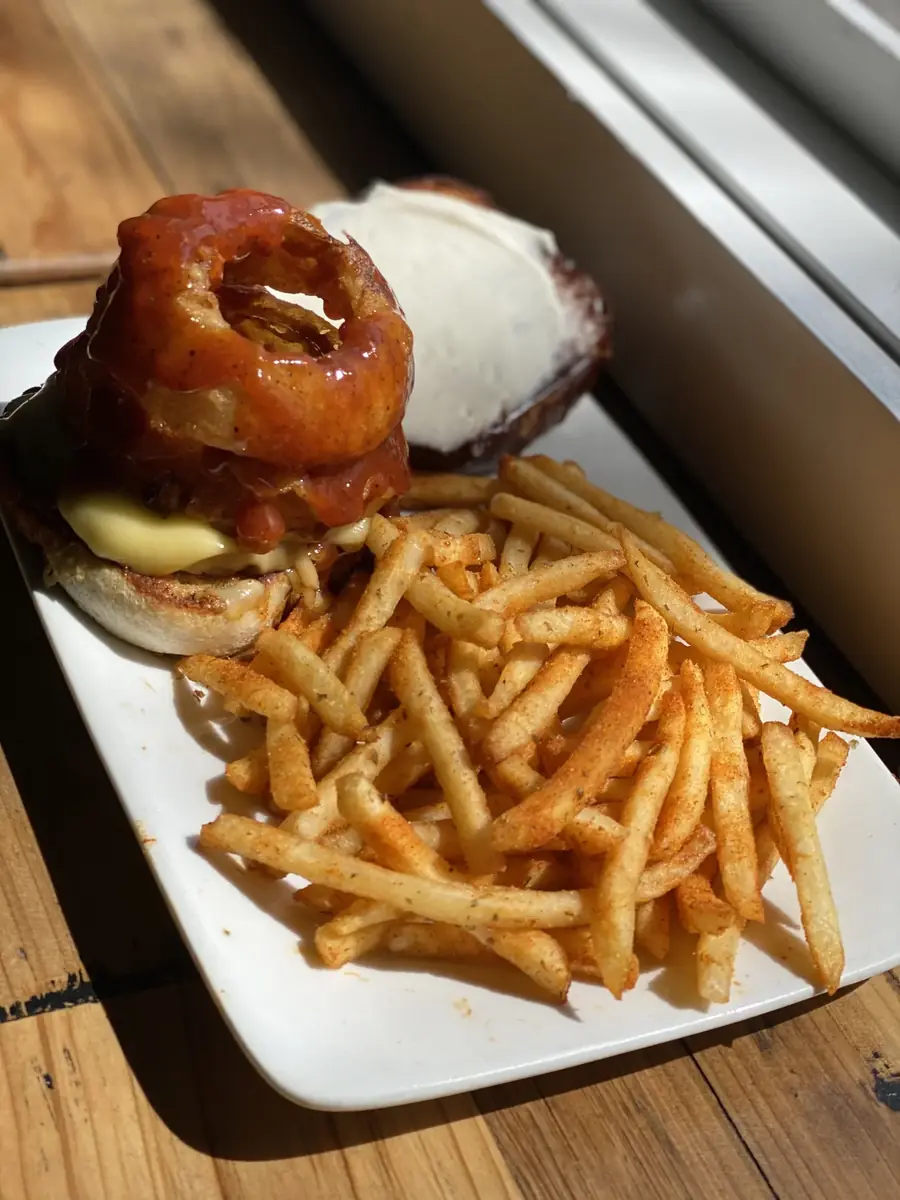 BBQ burger with fried onion rings, gouda and seasoned fries